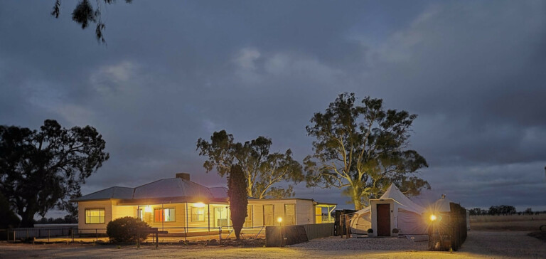 Redgum River Retreat at dusk with illuminated grounds and country settings