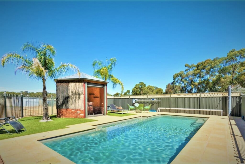 Whispering Woods Retreat with private solar heated pool.